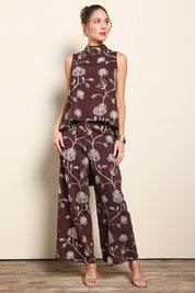 Model Maddiec wearing size 10 of the Celia Pants - Chocolategold in colour Chocolategold, from the front