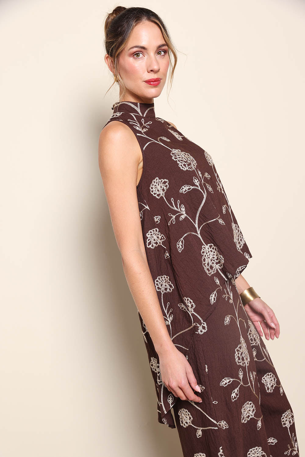 Model Maddiec wearing size 10 of the Celia Top - Chocolategold in colour Chocolategold, from an angle