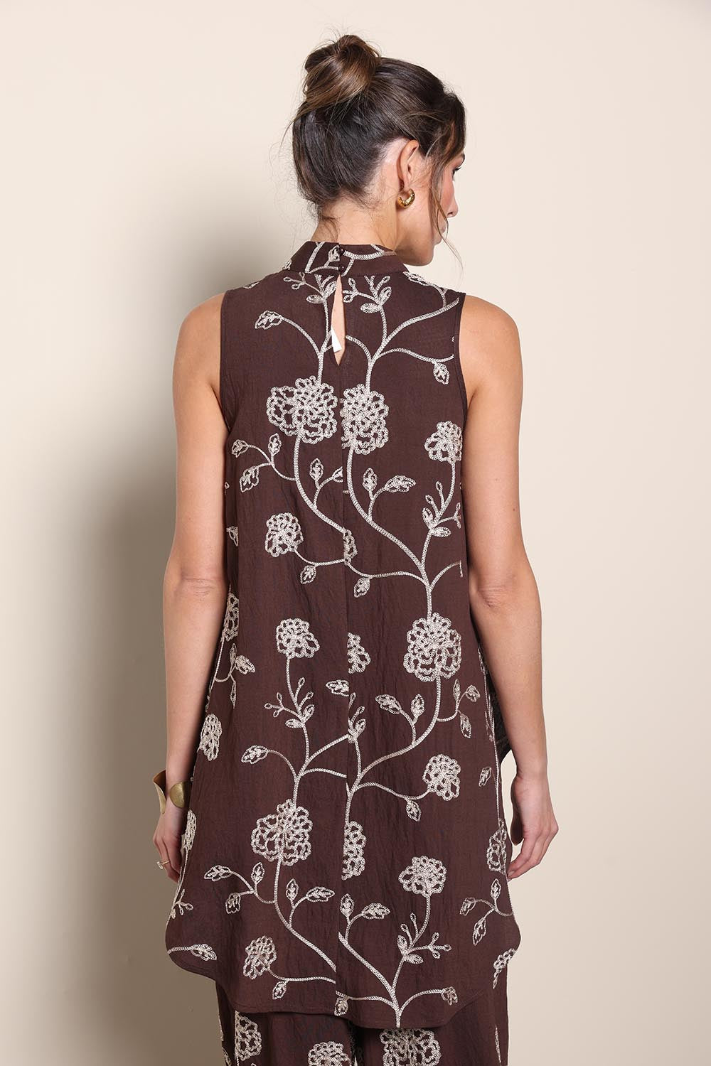 Model Maddiec wearing size 10 of the Celia Top - Chocolategold in colour Chocolategold, from the back