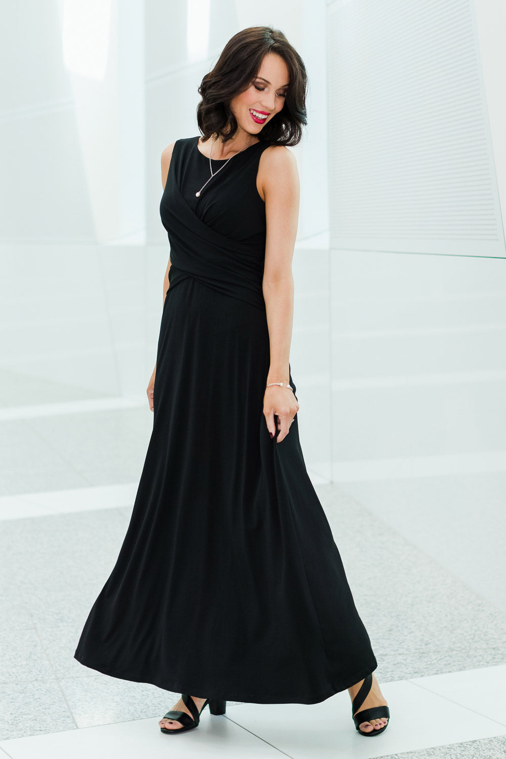 Model Andrea wearing size 10 of the Alexa Dress in colour Black (Black), from the front, showing the whole outfit