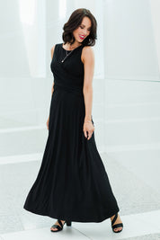 Model Andrea wearing size 10 of the Alexa Dress in colour Black (Black), from the front, showing the whole outfit