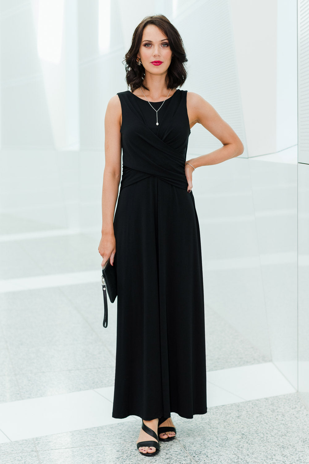 Model Andrea wearing size 10 of the Alexa Dress in colour Black (Black), from the front, showing the whole outfit