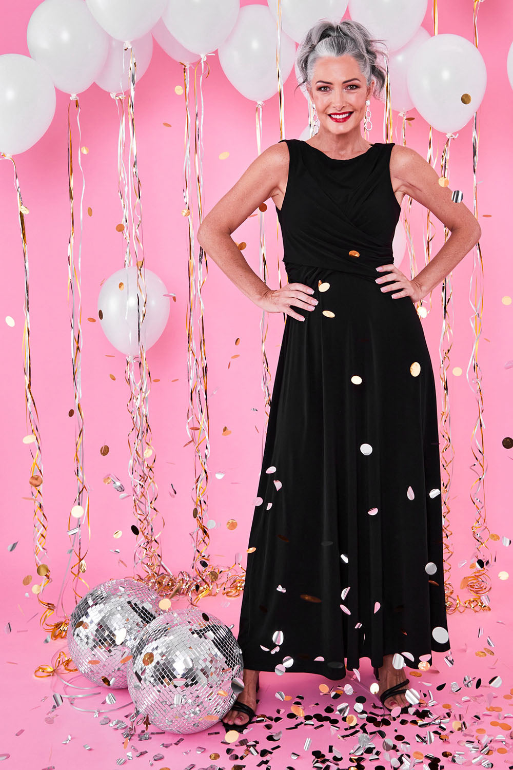 Model Luisa wearing size 10 of the Alexa Dress in colour Black (Black), from the front, showing the whole outfit