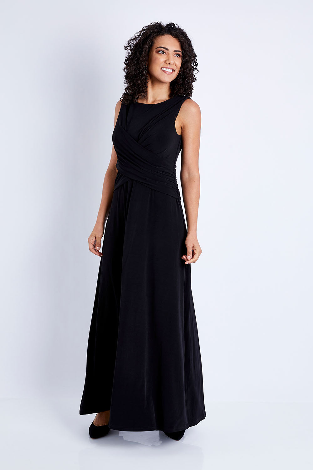 Model Pamela wearing size 10 of the Alexa Dress in colour Black (Black), from the front, showing the whole outfit