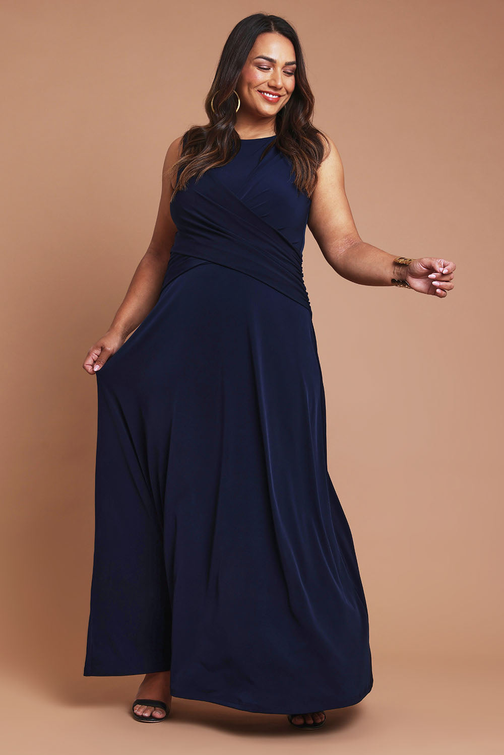Model Ashleigh wearing size 16 of the Alexa Dress in colour Navy (Blue), from the front, showing the whole outfit