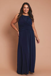 Model Ashleigh wearing size 16 of the Alexa Dress in colour Navy (Blue), from the front, showing the whole outfit