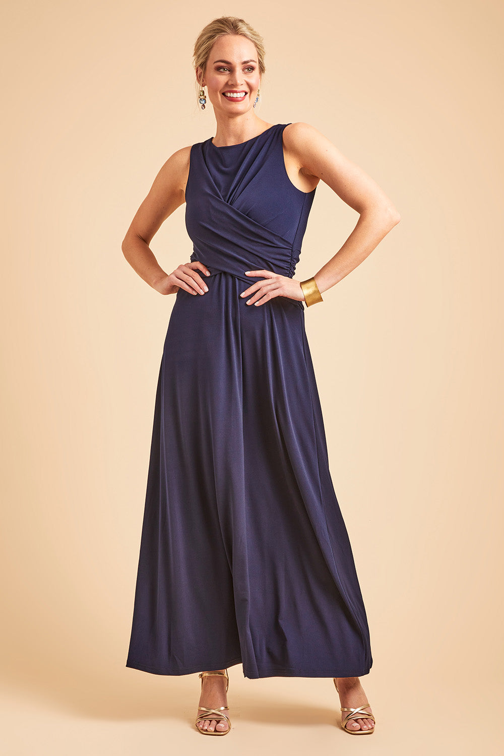 Model Grace wearing size 10 of the Alexa Dress in colour Navy (Blue), from the front, showing the whole outfit