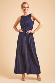 Model Grace wearing size 10 of the Alexa Dress in colour Navy (Blue), from the front, showing the whole outfit