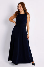 Model Jessica wearing size 14 of the Alexa Dress in colour Navy (Blue), from the front, showing the whole outfit