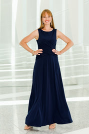 Model Katie wearing size 10 of the Alexa Dress in colour Navy (Blue), from the front, showing the whole outfit