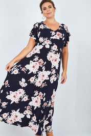Model Fiona wearing size 16 of the Lucille Dress in colour NavyFloral (Blue), from the front, showing the whole outfit