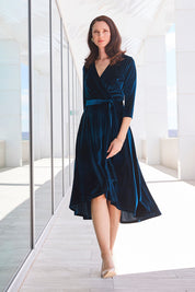 Model Anneliese wearing size 10 of the Annabelle Dress in colour Opal (Blue), from the front, showing the whole outfit