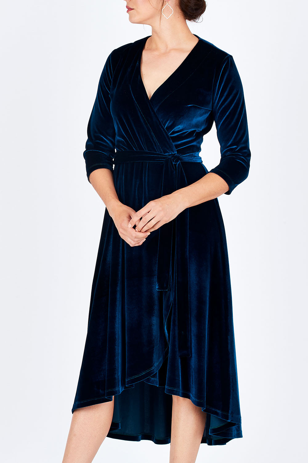 Model Rebecca wearing size 10 of the Annabelle Dress in colour Opal (Blue), from the front, cropped image