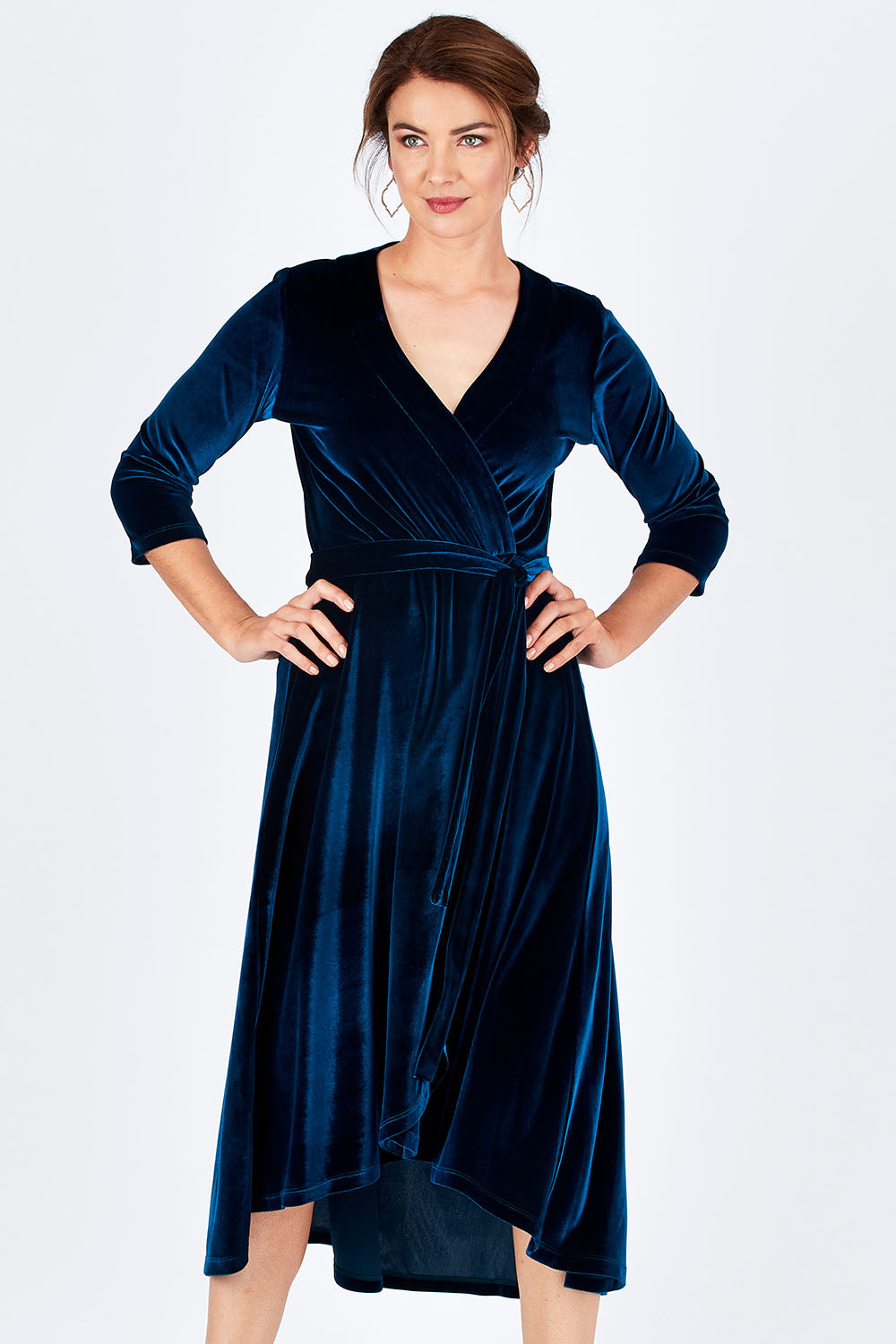 Model Rebecca wearing size 10 of the Annabelle Dress in colour Opal (Blue), from the front, cropped image