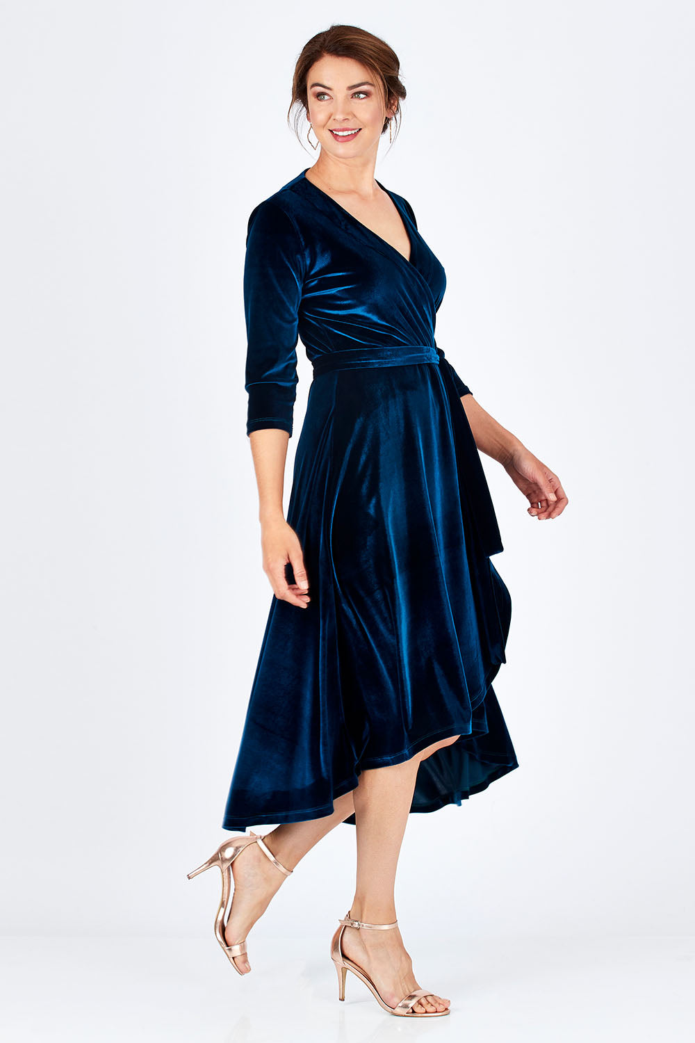 Model Rebecca wearing size 10 of the Annabelle Dress in colour Opal (Blue), from the front, showing the whole outfit