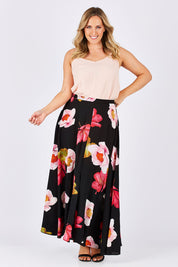 Model Jess wearing size 14 of the Hannah Skirt in colour Goddess (Black), from the front, showing the whole outfit
