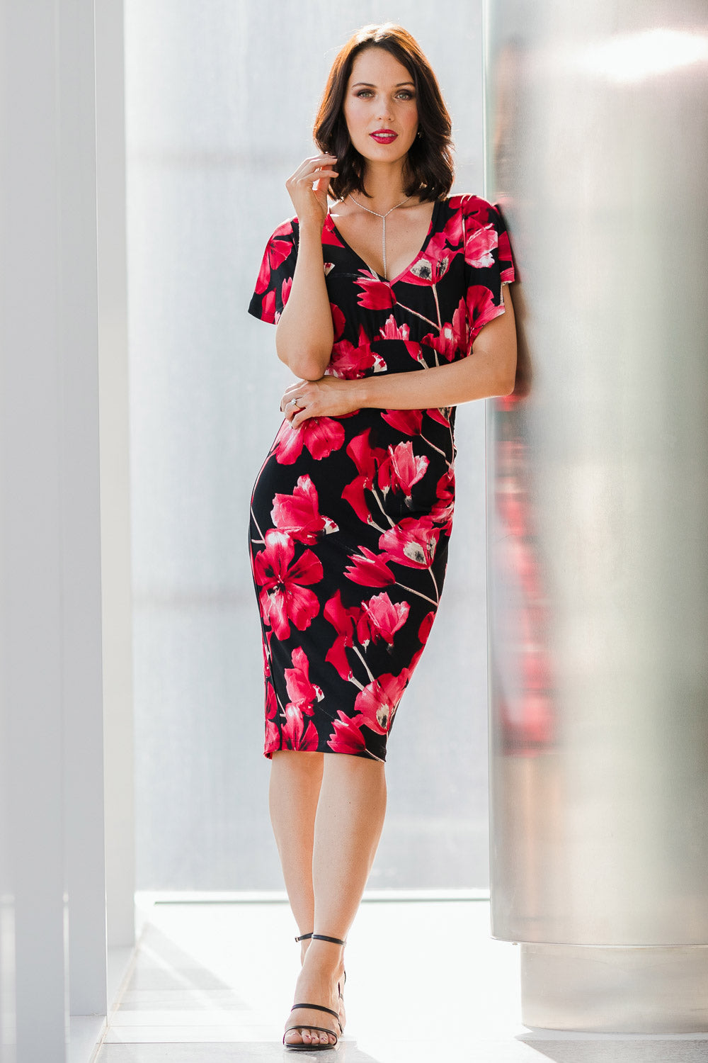 Model Andrea wearing size 10 of The Printed Anna Dress in colour Scarlet (Red), from the front, showing the whole outfit