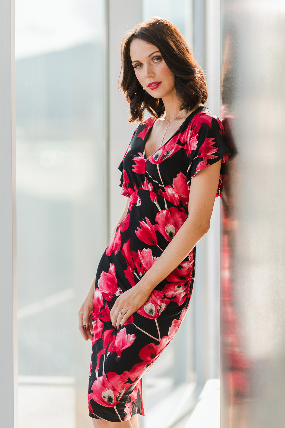 Model Andrea wearing size 10 of The Printed Anna Dress in colour Scarlet (Red), from the front, showing the whole outfit