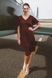 Model Anneliese wearing size 10 of the Kimberley Dress in colour Wine (Red), from the front, showing the whole outfit