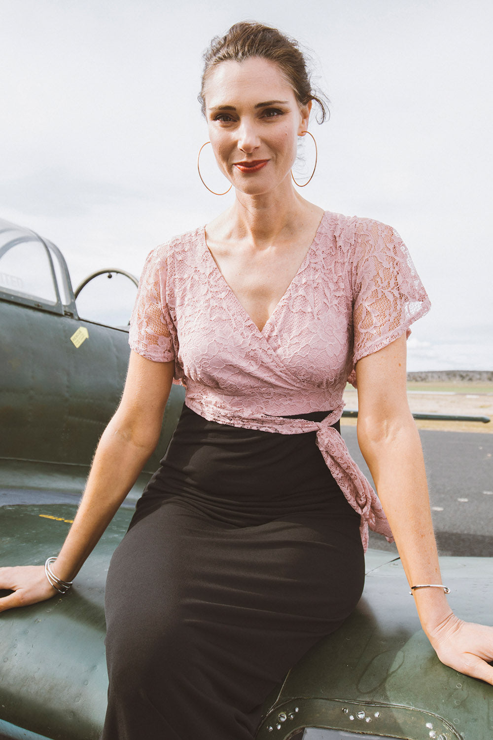Model Anneliese wearing size 10 of the Clara Dress in colour Blackblush (Black), from the front, showing the whole outfit