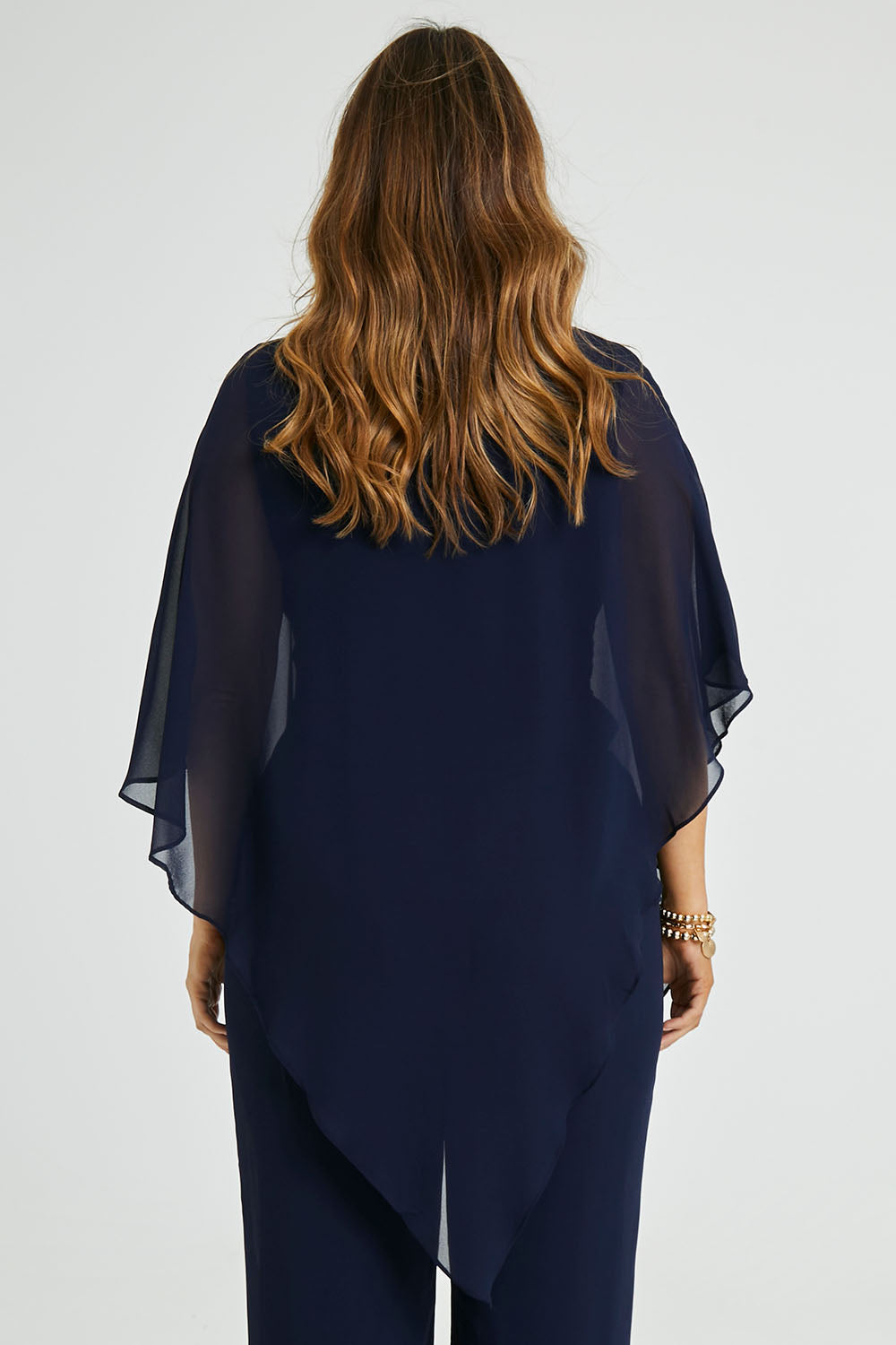 Model Laura wearing size 14 of the Marie Top in colour Navy (Blue), from the back