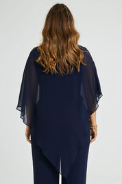 Model Laura wearing size 14 of the Marie Top in colour Navy (Blue), from the back