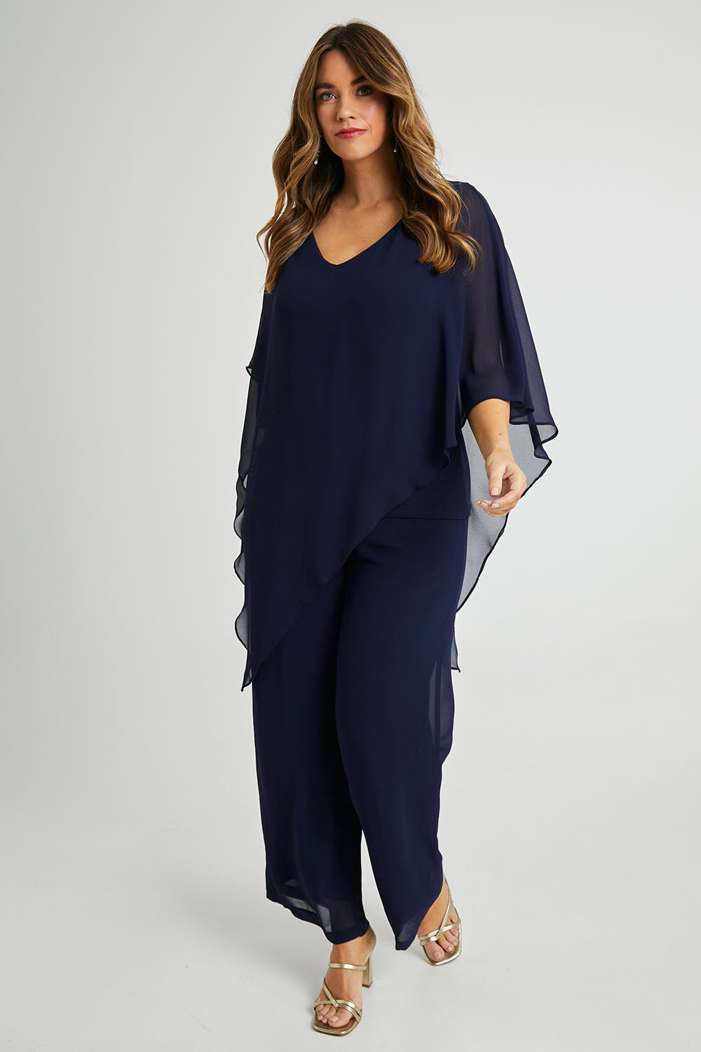 Model Laura wearing size 14 of the Marie Top in colour Navy (Blue), from the front, showing the whole outfit