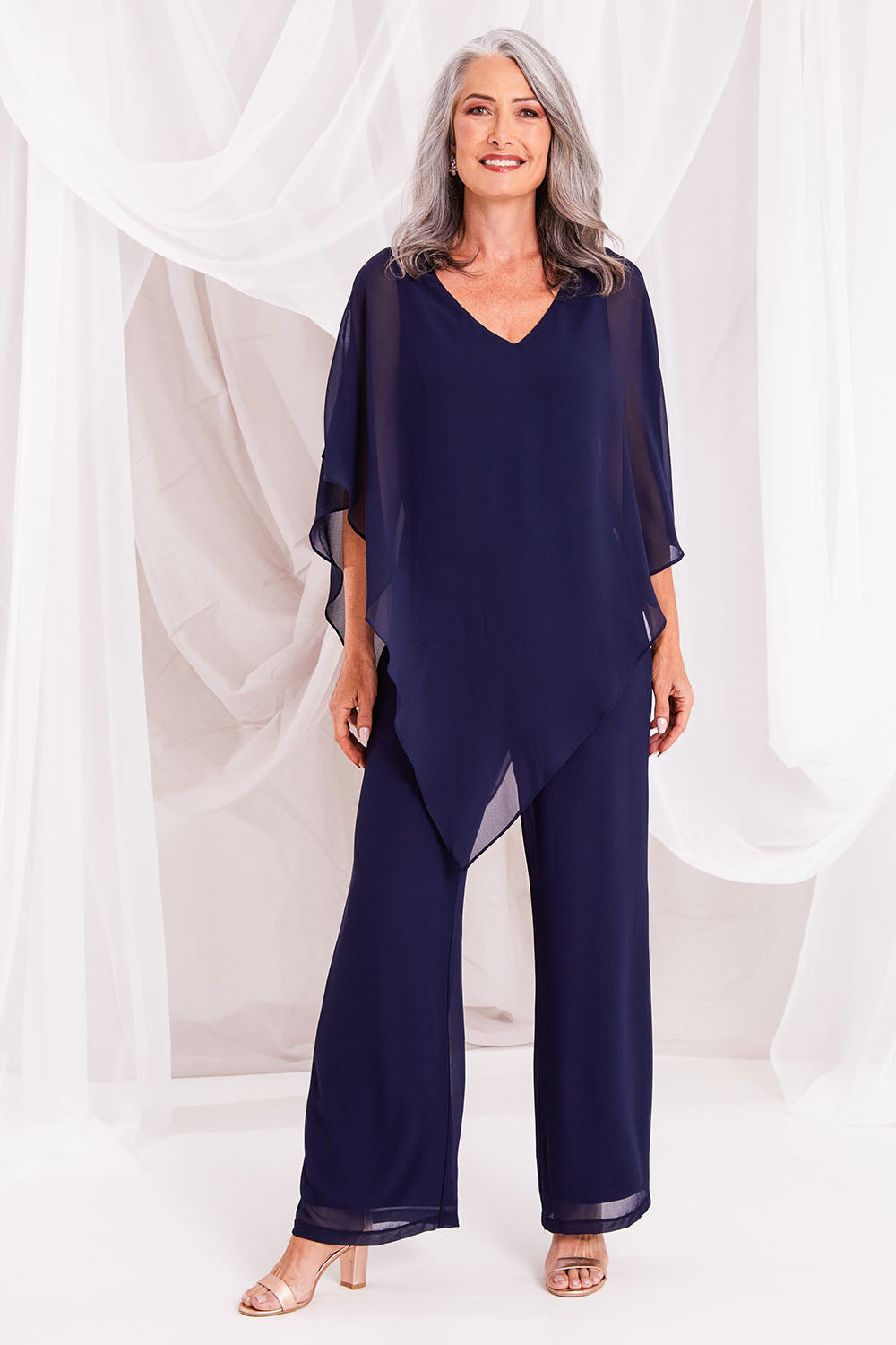 Model Luisa wearing size 10 of the Marie Top in colour Navy (Blue), from the front, showing the whole outfit