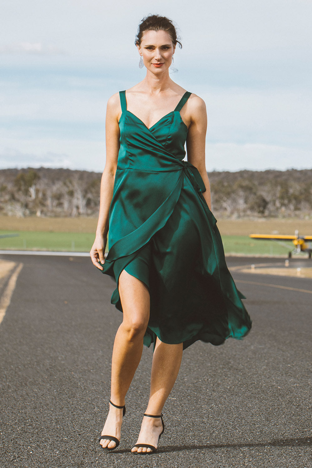 Model Anneliese wearing size 10 of the Amy Dress in colour Envy (Green), from the front, showing the whole outfit
