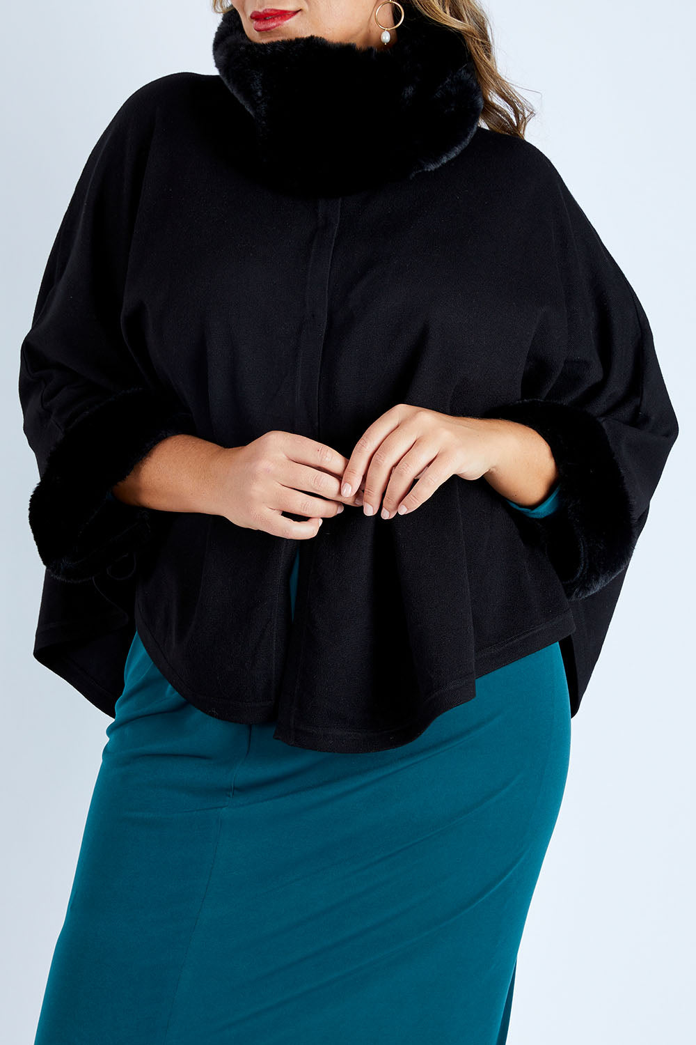 Model Fiona wearing size OneSize of the Brigitte Cape in colour Black (Black), from the front, cropped image
