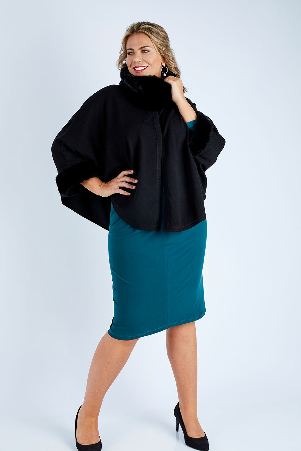 Model Fiona wearing size OneSize of the Brigitte Cape in colour Black (Black), from the front, showing the whole outfit