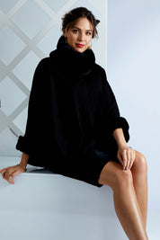 Model Madeline wearing size OneSize of the Brigitte Cape in colour Black (Black), from the front, showing the whole outfit