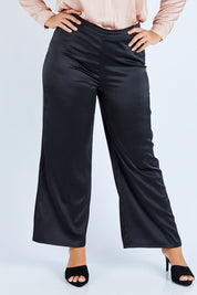 Model Fiona wearing size 16 of the Tina Pants in colour Black (Black), from the front, cropped image