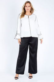Model Jess wearing size 14 of the Tina Pants in colour Black (Black), from the front, showing the whole outfit