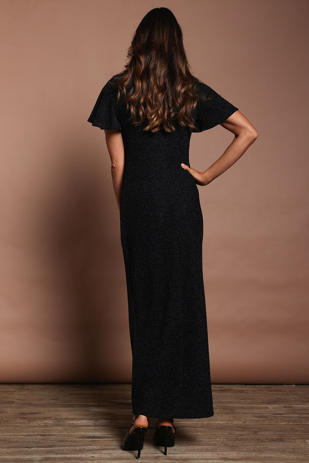 Model Amanda wearing size 10 of the Piper Dress in colour Black (Black), from the back