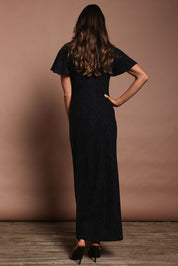 Model Amanda wearing size 10 of the Piper Dress in colour Black (Black), from the back