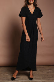 Model Amanda wearing size 10 of the Piper Dress in colour Black (Black), from the front, cropped image