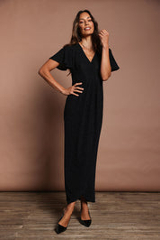 Model Amanda wearing size 10 of the Piper Dress in colour Black (Black), from the front, showing the whole outfit