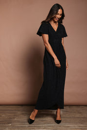 Model Amanda wearing size 10 of the Piper Dress in colour Black (Black), from the front, showing the whole outfit