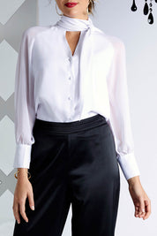 Model Madeline wearing size 10 of the Elena Blouse in colour Snow (White), from the front, cropped image