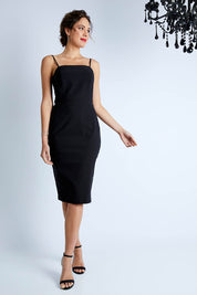 Model Madeline wearing size 10 of the Lola Dress in colour Black (Black), from the front, showing the whole outfit