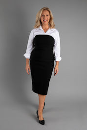 Model Sandy wearing size 10 of the Lola Dress in colour Black (Black), from the front, showing the whole outfit