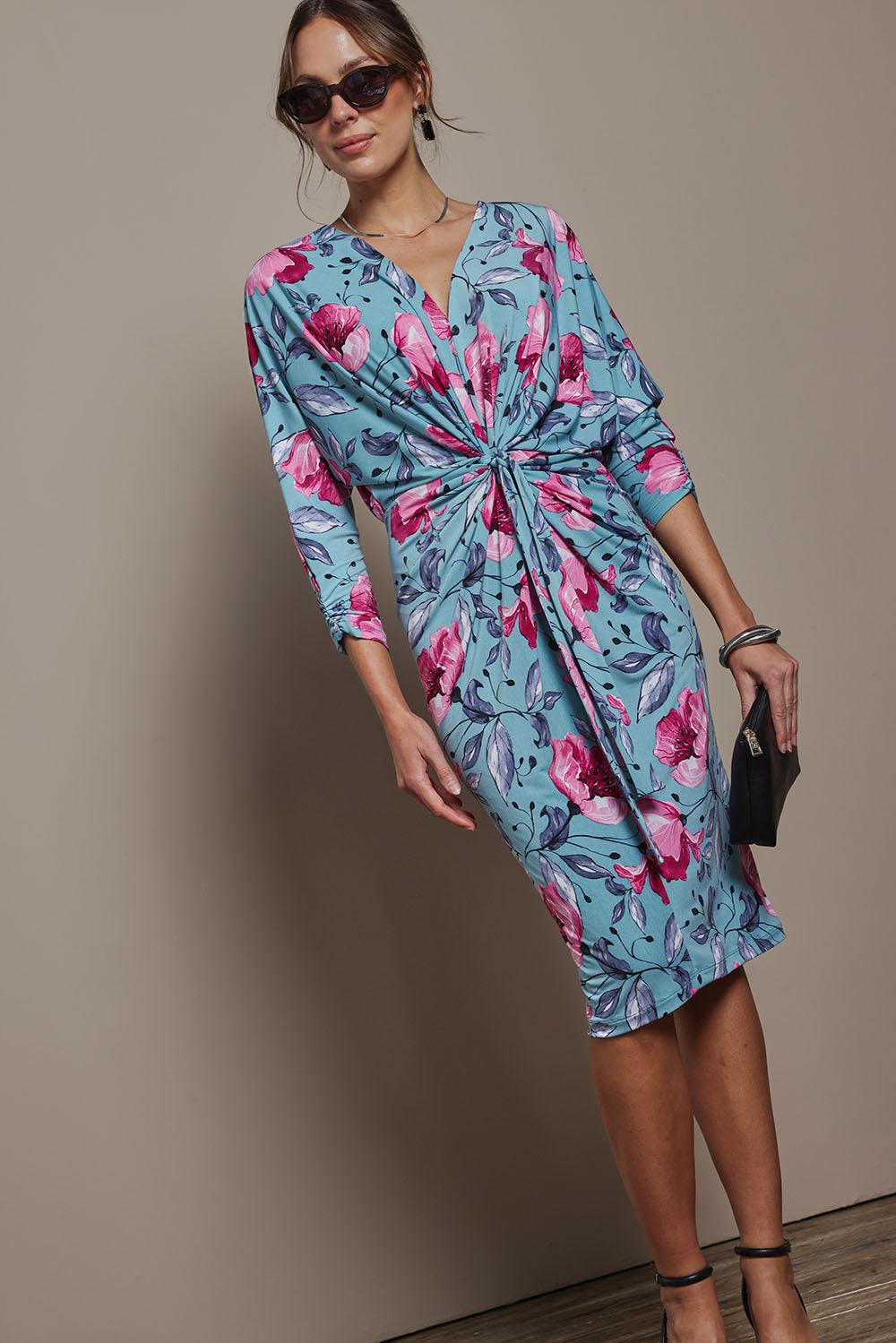 Model Madeline wearing size 10 of The Printed Nancy Dress in colour Windflower, from the front, showing the whole outfit