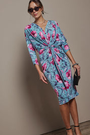 Model Madeline wearing size 10 of The Printed Nancy Dress in colour Windflower, from the front, showing the whole outfit