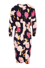 Product shot of The Printed Nancy Dress in colour Poppies (Pink), from the back