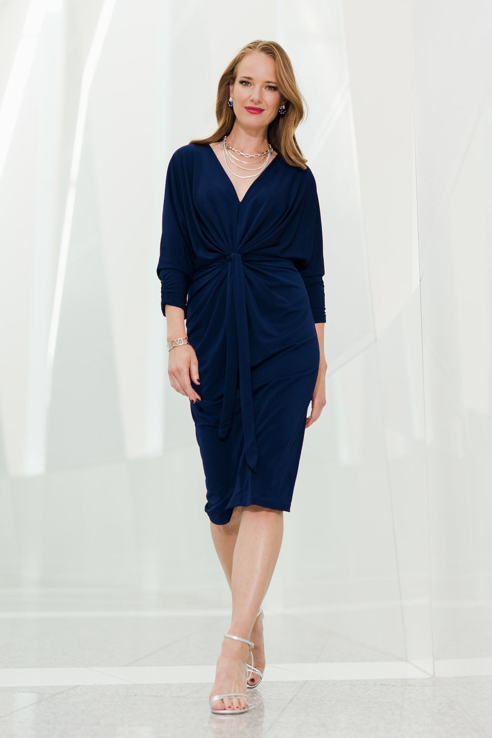 Model Katie wearing size 10 of the Nancy Dress in colour Navy (Blue), from the front, showing the whole outfit