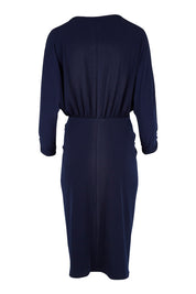 Product shot of the Nancy Dress in colour Navy (Blue), from the back