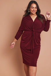 Model Ashleigh wearing size 16 of the Nancy Dress in colour Port (Red), from the front, showing the whole outfit