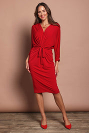 Model Madeline wearing size 10 of the Nancy Dress in colour Red (Red), from the front, showing the whole outfit