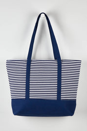 A model wearing size OneSize of the Sorrento Beach Bag in colour Bluestripe (Blue), from the front, showing the whole outfit